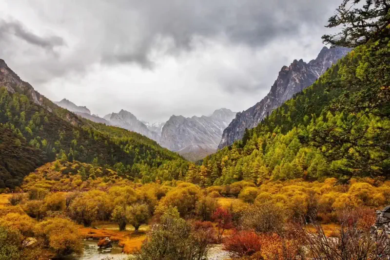 Autumn colors settle across a valley landscape.
